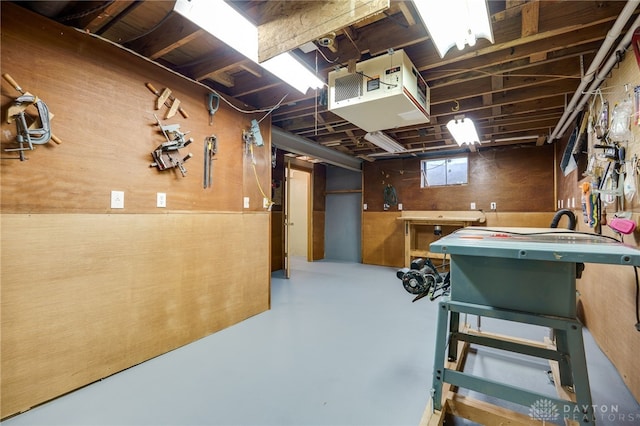 164 Winding Way, Kettering, OH 45429 - basement with a workshop area, a heating unit, and wood walls