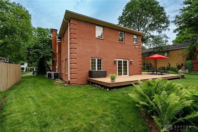 164 Winding Way, Kettering, OH 45429 - back of property with a wooden deck, brick siding, and outdoor dining area