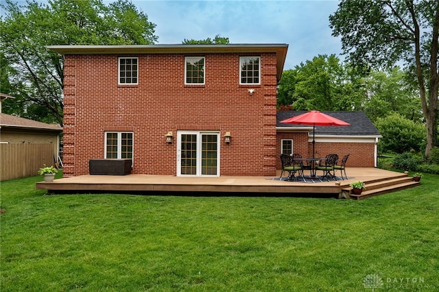 164 Winding Way, Kettering, OH 45429 - rear view of house with brick siding, a deck, and outdoor dining area