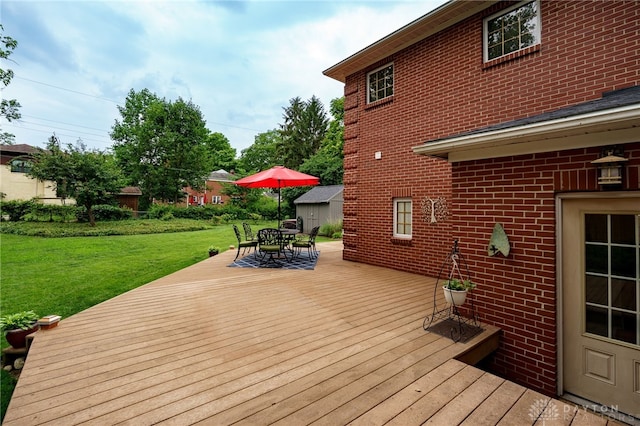 164 Winding Way, Kettering, OH 45429 - wooden deck featuring a yard and outdoor dining space
