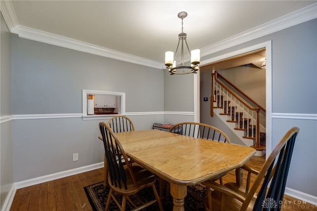 164 Winding Way, Kettering, OH 45429 - dining area with a chandelier, crown molding, wood finished floors, and stairway