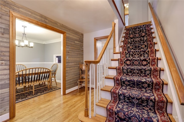 164 Winding Way, Kettering, OH 45429 - stairway featuring a chandelier, wood finished floors, and ornamental molding