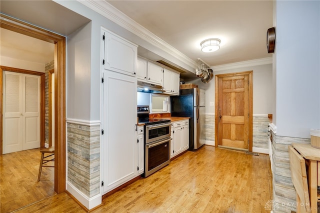 164 Winding Way, Kettering, OH 45429 - kitchen featuring appliances with stainless steel finishes, under cabinet range hood, white cabinetry, light wood-style floors, and ornamental molding