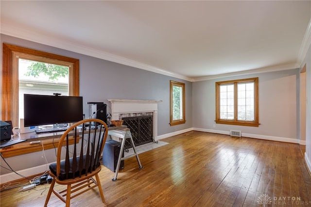 164 Winding Way, Kettering, OH 45429 - office area with wood-type flooring, crown molding, and a fireplace with flush hearth