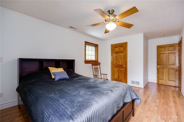 164 Winding Way, Kettering, OH 45429 - bedroom featuring light wood-type flooring and a ceiling fan