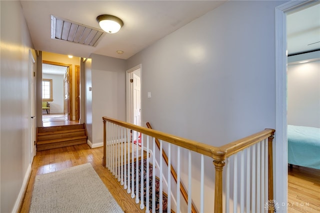 164 Winding Way, Kettering, OH 45429 - hallway with an upstairs landing and wood-type flooring