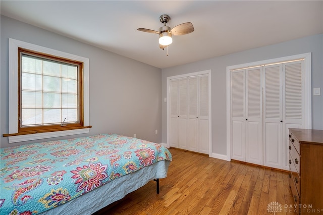 164 Winding Way, Kettering, OH 45429 - bedroom with light wood-style floors, two closets, and ceiling fan