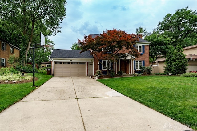 164 Winding Way, Kettering, OH 45429 - view of front facade with brick siding, an attached garage, a front yard, and driveway