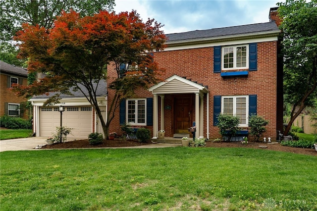 164 Winding Way, Kettering, OH 45429 - view of front of home with brick siding, a chimney, and driveway