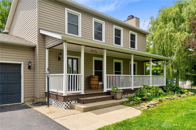 3075 Addison New Carlisle Rd, New Carlisle, OH 45344 - view of front of property featuring a porch and a chimney