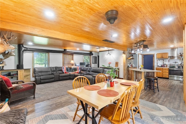 3075 Addison New Carlisle Rd, New Carlisle, OH 45344 - dining area with wood ceiling and wood finished floors
