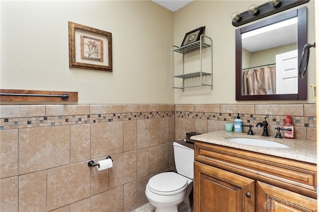 3075 Addison New Carlisle Rd, New Carlisle, OH 45344 - bathroom featuring vanity, tile walls, and wainscoting