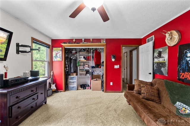 3075 Addison New Carlisle Rd, New Carlisle, OH 45344 - living room with a ceiling fan, carpet, and a textured ceiling