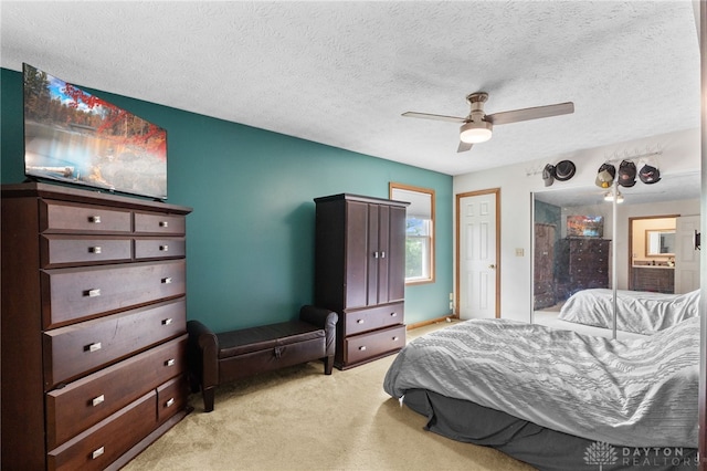 3075 Addison New Carlisle Rd, New Carlisle, OH 45344 - bedroom with light carpet, a textured ceiling, and a ceiling fan