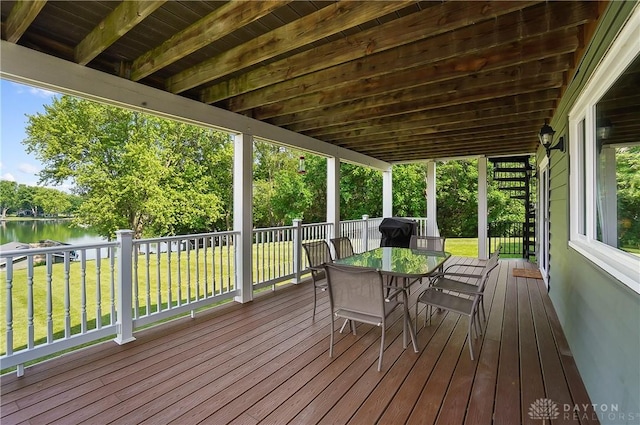 855 Quarry Rd, Silver Creek Twp, OH 45335 - wooden deck with a water view, a yard, and outdoor dining space