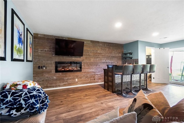 855 Quarry Rd, Silver Creek Twp, OH 45335 - living area with wood finished floors, a glass covered fireplace, and recessed lighting