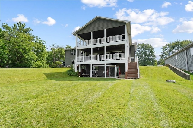855 Quarry Rd, Silver Creek Twp, OH 45335 - rear view of property with a lawn, stairway, a balcony, and a wooden deck