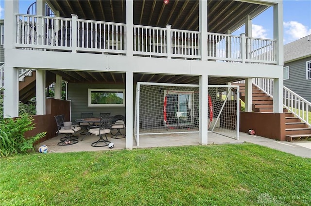 855 Quarry Rd, Silver Creek Twp, OH 45335 - rear view of house featuring stairs, a patio, and a lawn