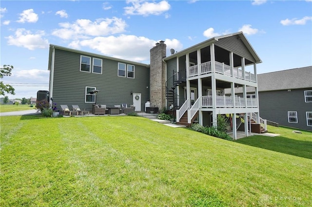 855 Quarry Rd, Silver Creek Twp, OH 45335 - back of property featuring stairs, a lawn, an outdoor living space, and a patio area