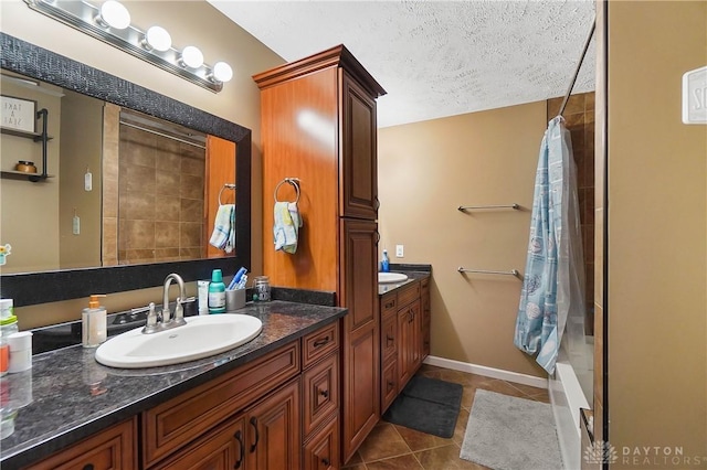 855 Quarry Rd, Silver Creek Twp, OH 45335 - full bathroom with vanity, tile patterned flooring, curtained shower, and a textured ceiling