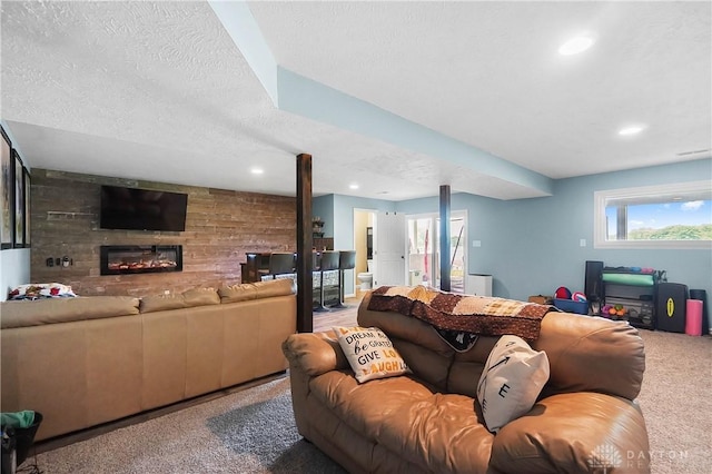855 Quarry Rd, Silver Creek Twp, OH 45335 - living area featuring carpet floors, a fireplace, a textured ceiling, and recessed lighting