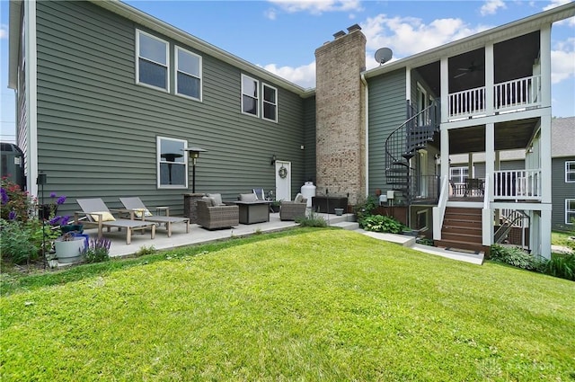 855 Quarry Rd, Silver Creek Twp, OH 45335 - rear view of property with stairs, a chimney, a lawn, and a patio area