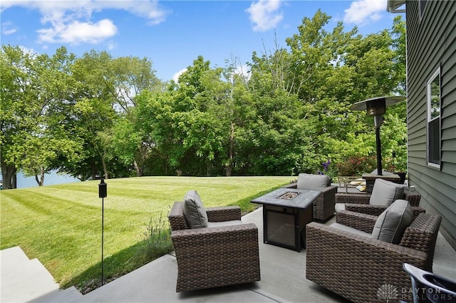 855 Quarry Rd, Silver Creek Twp, OH 45335 - view of patio featuring an outdoor fire pit and view of wooded area