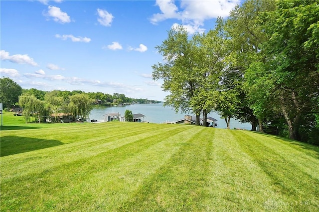 855 Quarry Rd, Silver Creek Twp, OH 45335 - view of grassy yard with a water view and a boat dock