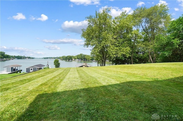 855 Quarry Rd, Silver Creek Twp, OH 45335 - view of grassy yard with a water view and a boat dock