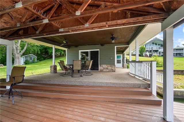 855 Quarry Rd, Silver Creek Twp, OH 45335 - wooden deck with ceiling fan, a yard, and outdoor dining space