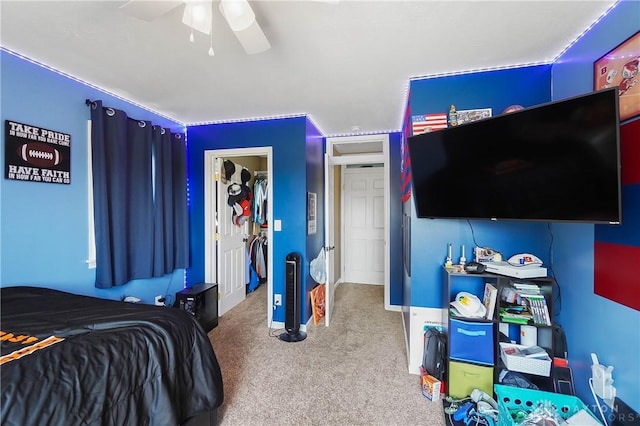 855 Quarry Rd, Silver Creek Twp, OH 45335 - carpeted bedroom with ceiling fan and a walk in closet