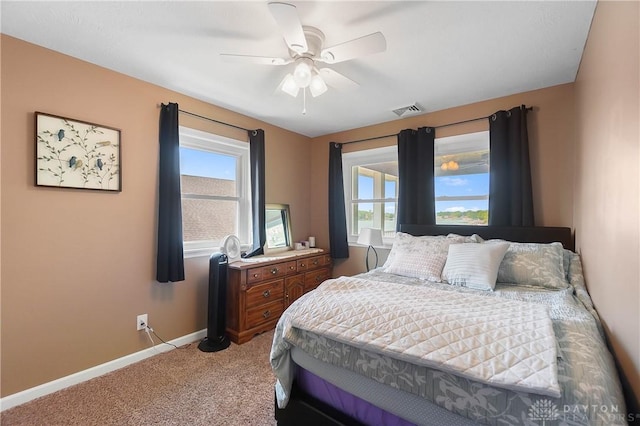 855 Quarry Rd, Silver Creek Twp, OH 45335 - bedroom with light carpet, multiple windows, and a ceiling fan