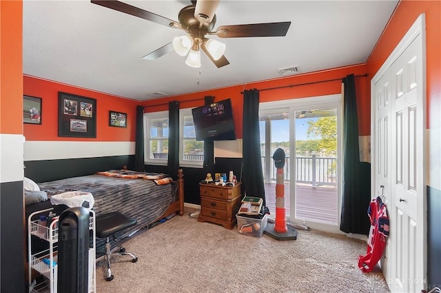855 Quarry Rd, Silver Creek Twp, OH 45335 - carpeted bedroom featuring access to exterior and ceiling fan