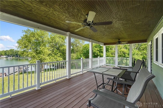 855 Quarry Rd, Silver Creek Twp, OH 45335 - wooden terrace with a water view, a ceiling fan, a lawn, and view of wooded area