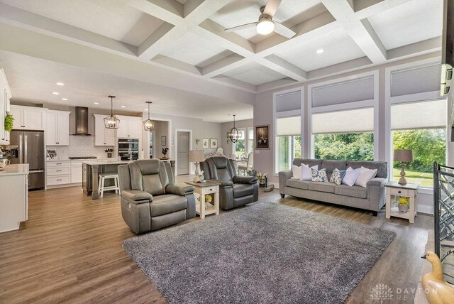 1015 Settlemyre Rd, Oregonia, OH 45054 - living area featuring a ceiling fan, wood finished floors, recessed lighting, beamed ceiling, and coffered ceiling