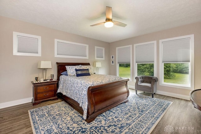 1015 Settlemyre Rd, Oregonia, OH 45054 - bedroom featuring dark wood-type flooring, ceiling fan, and a textured ceiling
