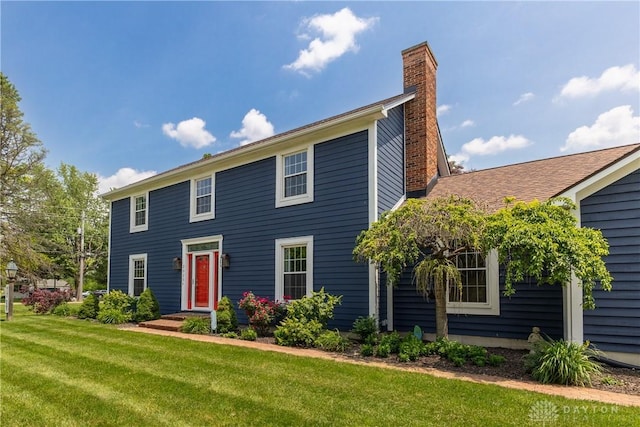 2025 Seneca Dr, Troy, OH 45373 - colonial home with a chimney and a front lawn
