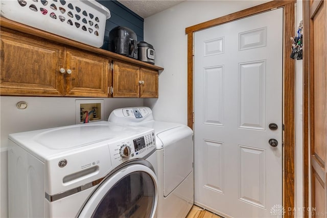 2025 Seneca Dr, Troy, OH 45373 - washroom with washer and dryer and cabinet space