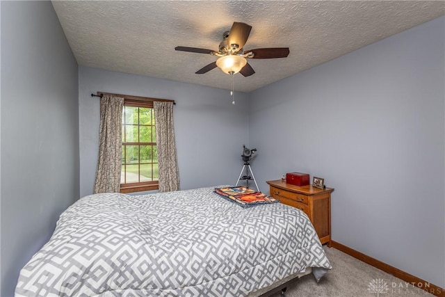 2025 Seneca Dr, Troy, OH 45373 - carpeted bedroom featuring a textured ceiling and ceiling fan