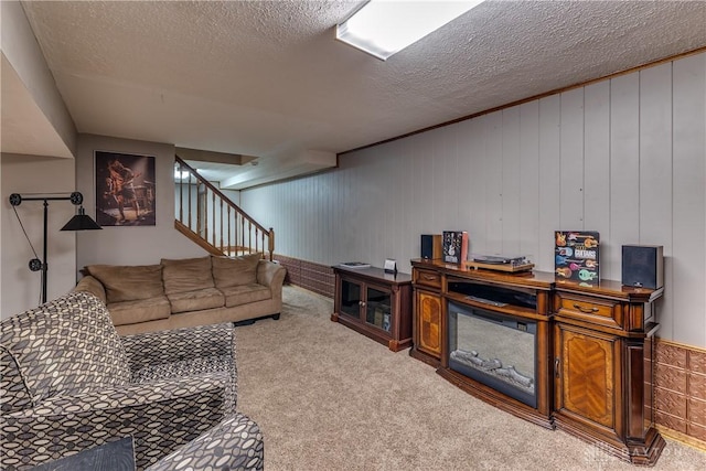 2025 Seneca Dr, Troy, OH 45373 - carpeted living area with stairway and a textured ceiling