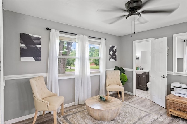 8684 Woodview Dr, Cincinnati, OH 45231 - sitting room with light wood finished floors and a ceiling fan
