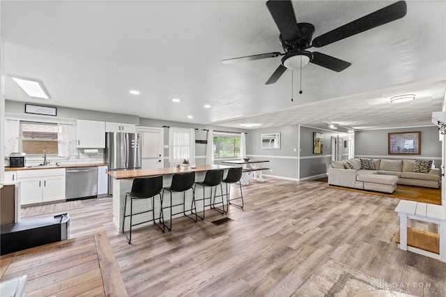 8684 Woodview Dr, Cincinnati, OH 45231 - living room featuring light wood-type flooring, recessed lighting, and a ceiling fan