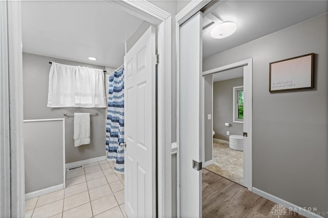 8684 Woodview Dr, Cincinnati, OH 45231 - bathroom with baseboards and curtained shower