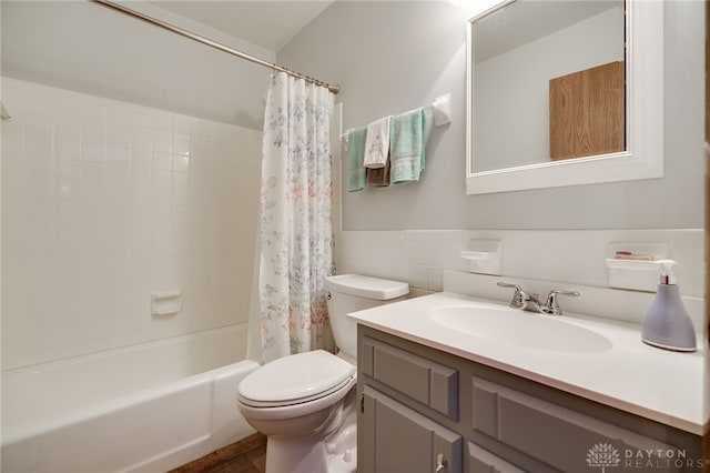 1396 Surrey Rd, Vandalia, OH 45377 - bathroom featuring vanity, shower / bath combination with curtain, tile walls, a wainscoted wall, and wood finished floors