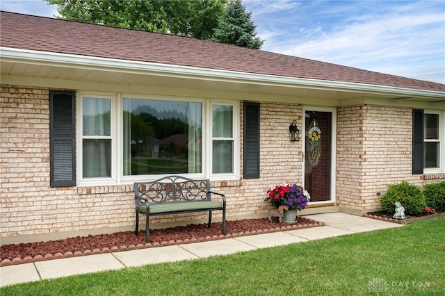 1396 Surrey Rd, Vandalia, OH 45377 - view of front facade with brick siding, roof with shingles, and a front yard