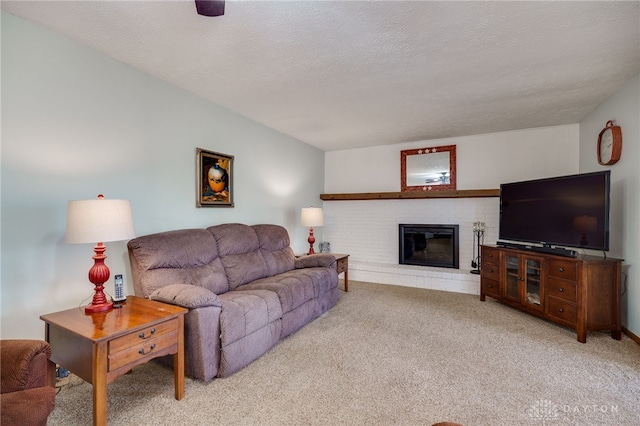 1396 Surrey Rd, Vandalia, OH 45377 - living area featuring carpet flooring, a brick fireplace, and a textured ceiling