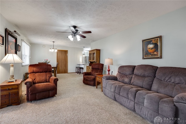 1396 Surrey Rd, Vandalia, OH 45377 - carpeted living area with a ceiling fan, a chandelier, and a textured ceiling