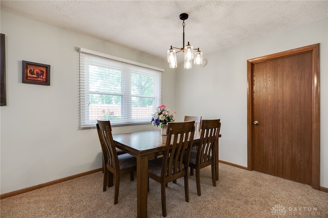 1396 Surrey Rd, Vandalia, OH 45377 - dining area with a chandelier, light carpet, and a textured ceiling