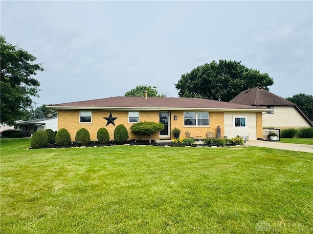 1637 Lammes Ln, New Carlisle, OH 45344 - ranch-style home with a front lawn and brick siding