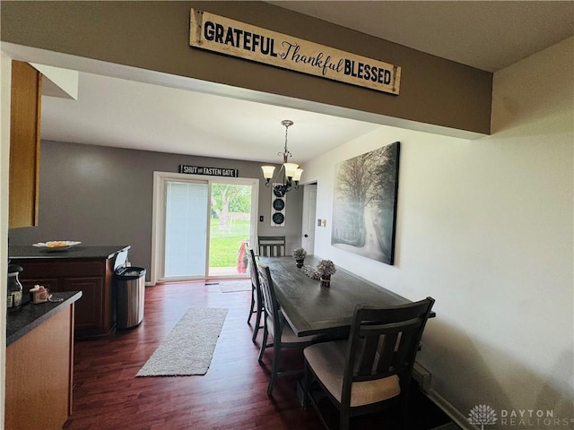 1637 Lammes Ln, New Carlisle, OH 45344 - dining space with dark wood finished floors and a chandelier